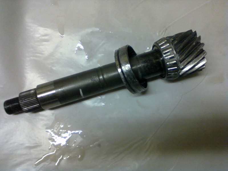 A fresh O-ring goes on the transfer shaft’s “lower” bearing race
